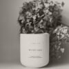 emlinehome_woodland soy candle_with flower_homepage